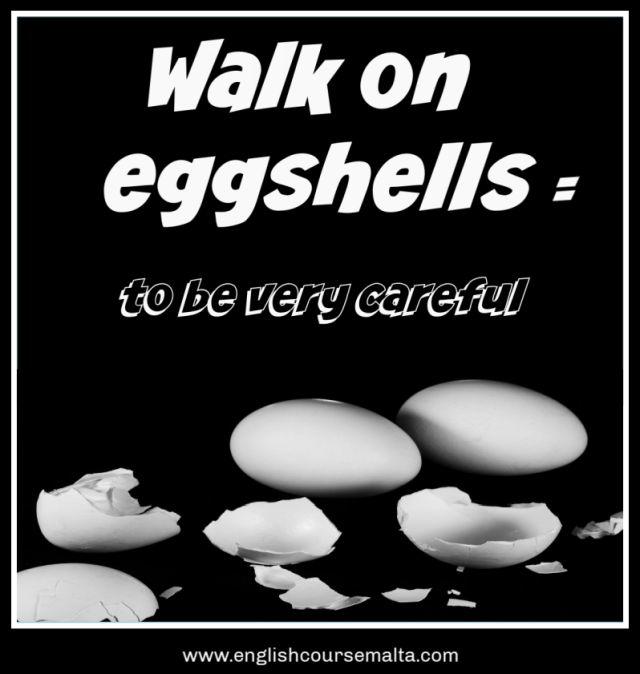 Picture with the words walk on eggshells. This English idiom means to be very careful.